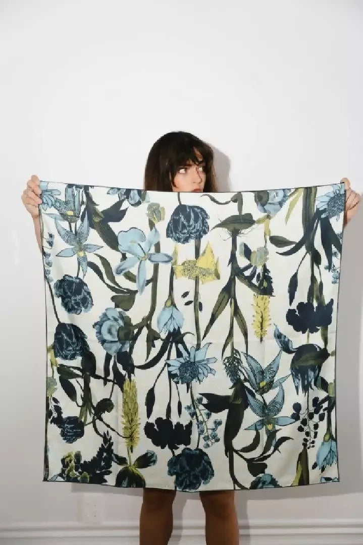 Luxury_silk_scarf_with_botanical_illustration_of_tulips_orchids_and_meadow_blooms_in_radiant_tones